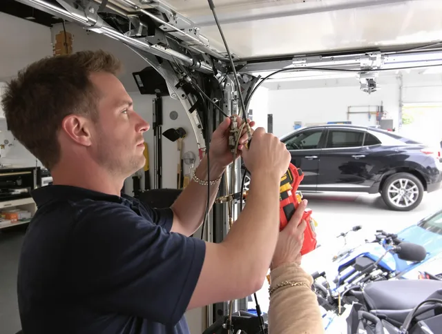 Colorado Springs Garage Door Repair safety certified technician performing cable replacement in Colorado Springs