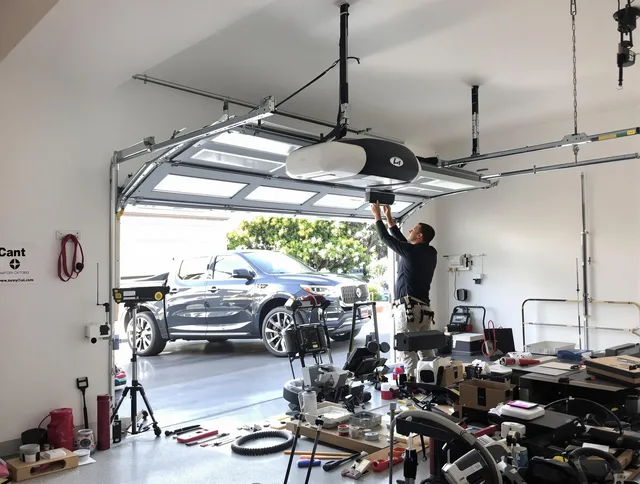 Colorado Springs Garage Door Repair specialist installing smart garage door opener system in Colorado Springs home