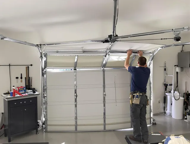 Colorado Springs Garage Door Repair specialist performing precise section replacement on Colorado Springs garage door
